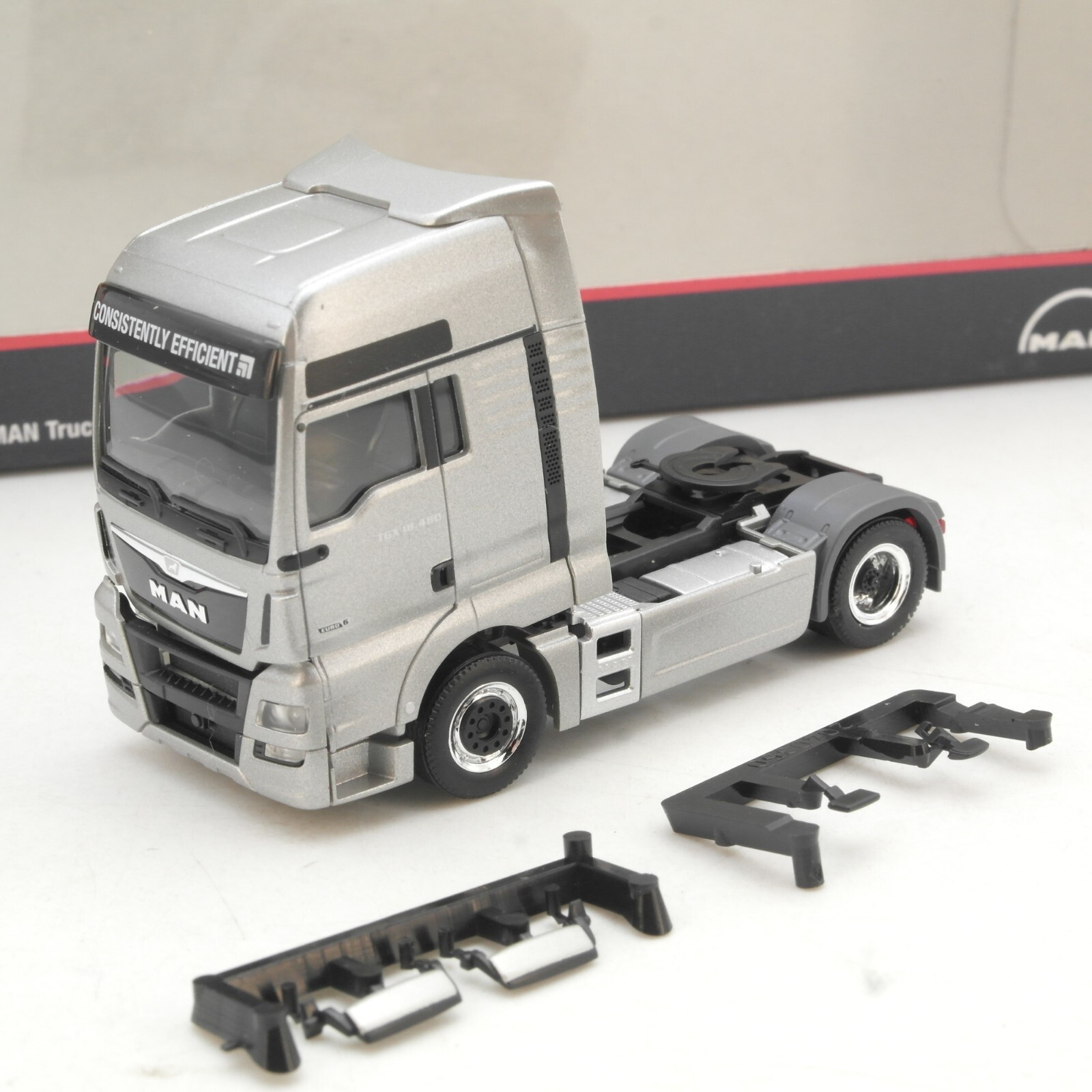 Herpa 1:87 MAN Zugmaschine Truck & Bus AG neuwertig in OVP QR1307
