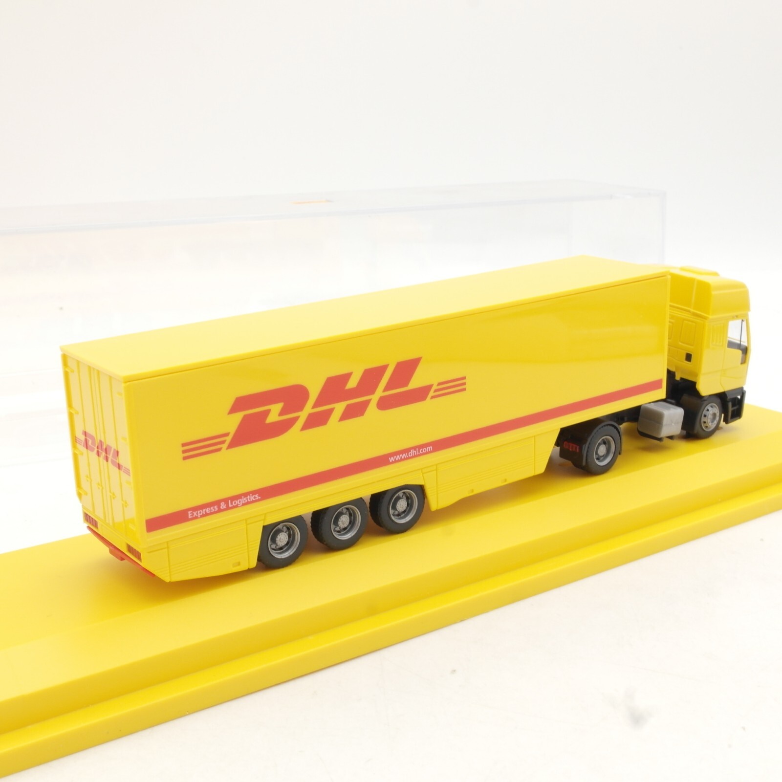 Herpa 1:87 Werbemodell Iveco Sattelzug DHL in PC Box QR973 – Bild 3
