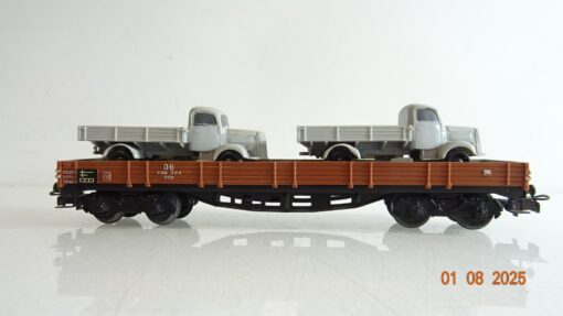 Märklin H0 Niederbordwagen vierachsig mit 2 LKW der DB PR9373 o.