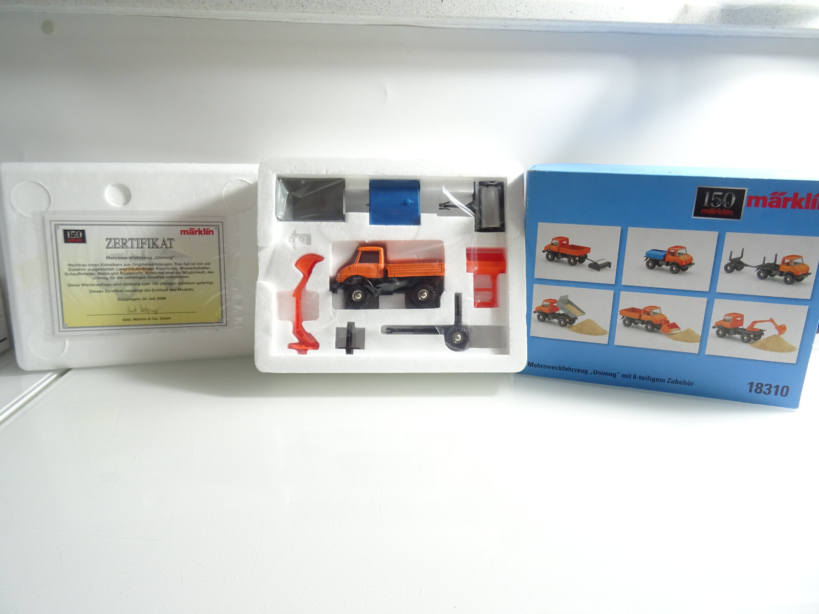 Märklin 18310 Mehrzweckfahrzeug Unimog mit Zubehör in OVP C53